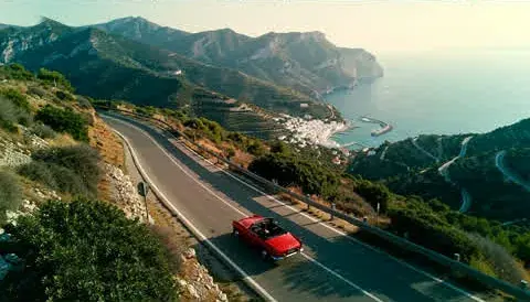 5. The convertible at the fork in the road, from a drone